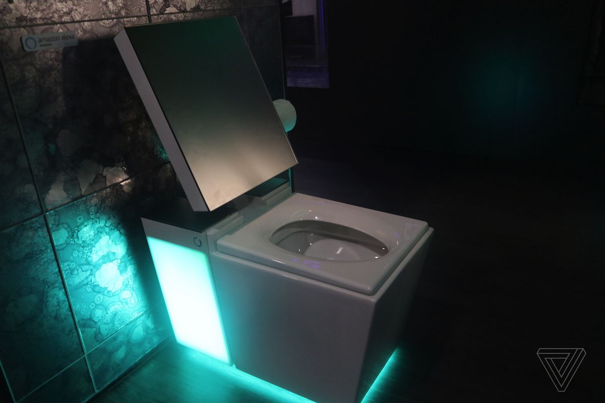 Smart toilet in dark room with lights