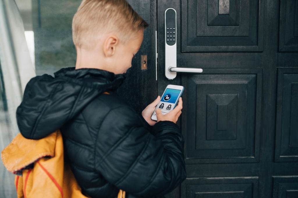 child unlocking door with phone for home automation